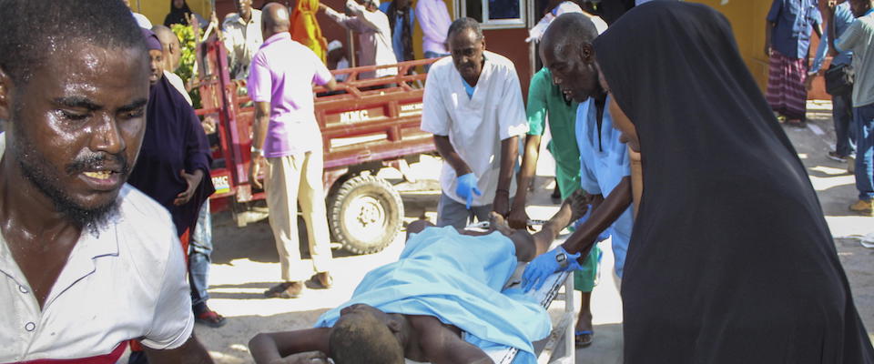 epaselect epa08092309 A wounded man is carried on a stretcher at Medina hospital in Mogadishu, Somalia, 28 December 2019. According reports, a large explosion rocked the area near Ex-control Afgoye. Initial police reports said at least five people were killed in what is believed to have been a car bombing.  EPA/SAID YUSUF WARSAME