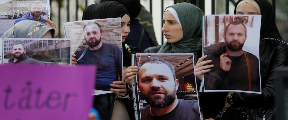 People hold portraits of Zelimkhan Khangoshvili in front of the German embassy in Tbilisi, Georgia, 10 September 2019. Khangoshvili, a former militant activist, was shot dead in Berlin on 23 August.  ANSA/ZURAB KURTSIKIDZE