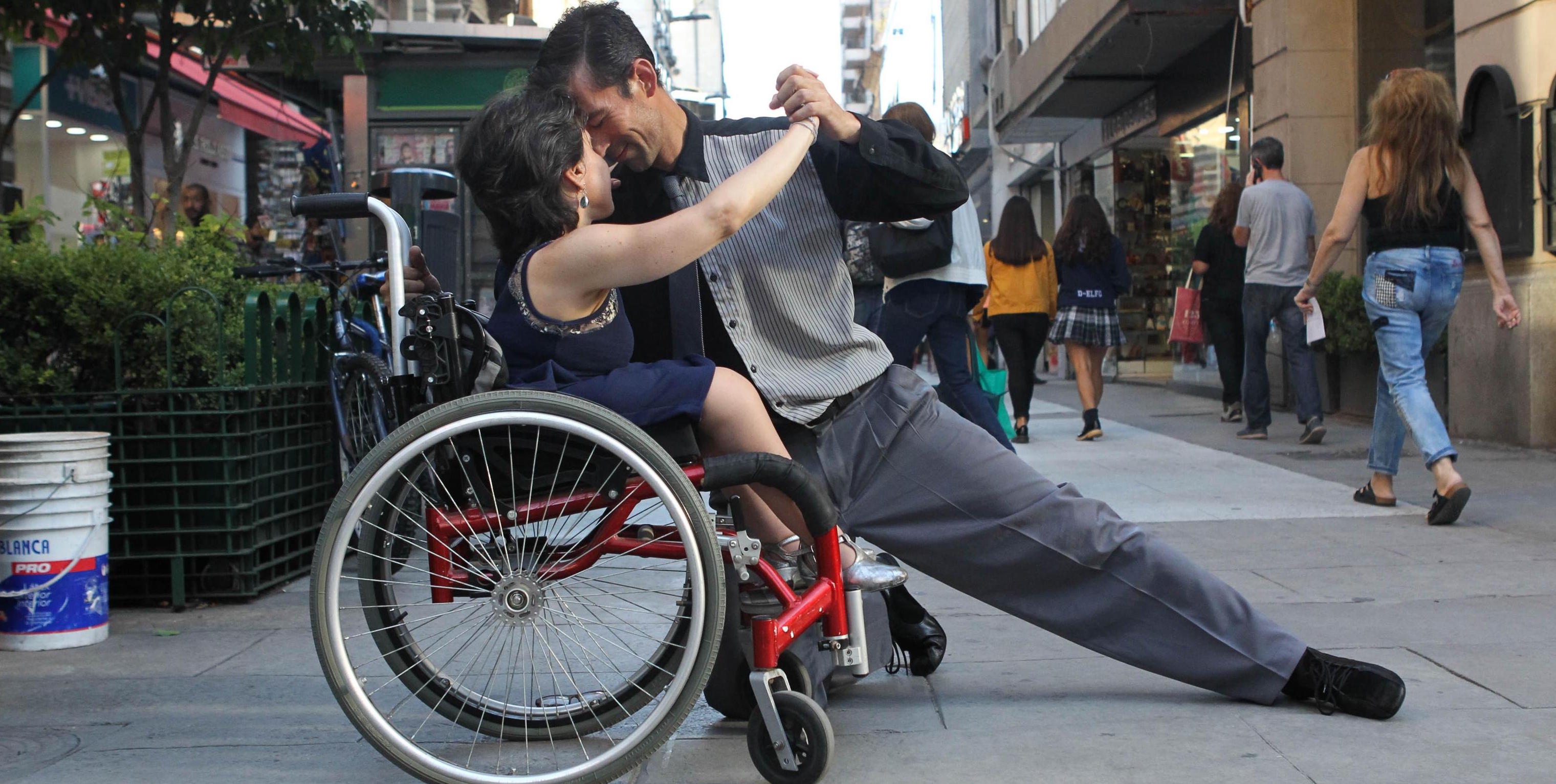 epa07459897 Street tango dancers Brenda Holtz (L) and Horacio Tolosa dance in downtown Buenos Aires, Argentina, 14 March 2019 (issued on 24 March 2019). Brenda, a 42-years old disabled dancer, and Horacio,37, dance in the Buenos Aires’ streets in a passionate, tender and naughty way. Brenda learned the tango’s basic movements four years ago thanks to a friend, and now, she has lessons with a teacher who adapts the steps to her movements as there are only a couple of dance schools for disabled people in the city. ‘The only limit is your mind’ says Brenda.  EPA/Mar√≠a Paulina Rodr√≠guez