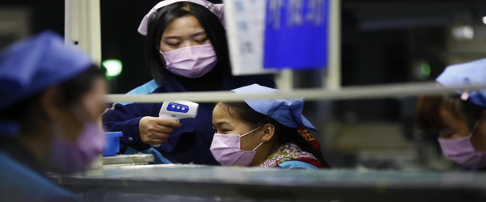 epa08208408 Workers resume work at an electronic components factory after an extended lunar new year holiday in Sihong County, Jiangsu Province, China, 10 February 2020. Chinese workers return to work after an extended lunar new year holiday to prevent the spread of the novel coronavirus (2019-nCoV) outbreak which originated in the Chinese city of Wuhan and has so far killed at least 910 people with over 40,000 infected worldwide, mostly in China.  EPA/XU CHANGLIANG CHINA OUT