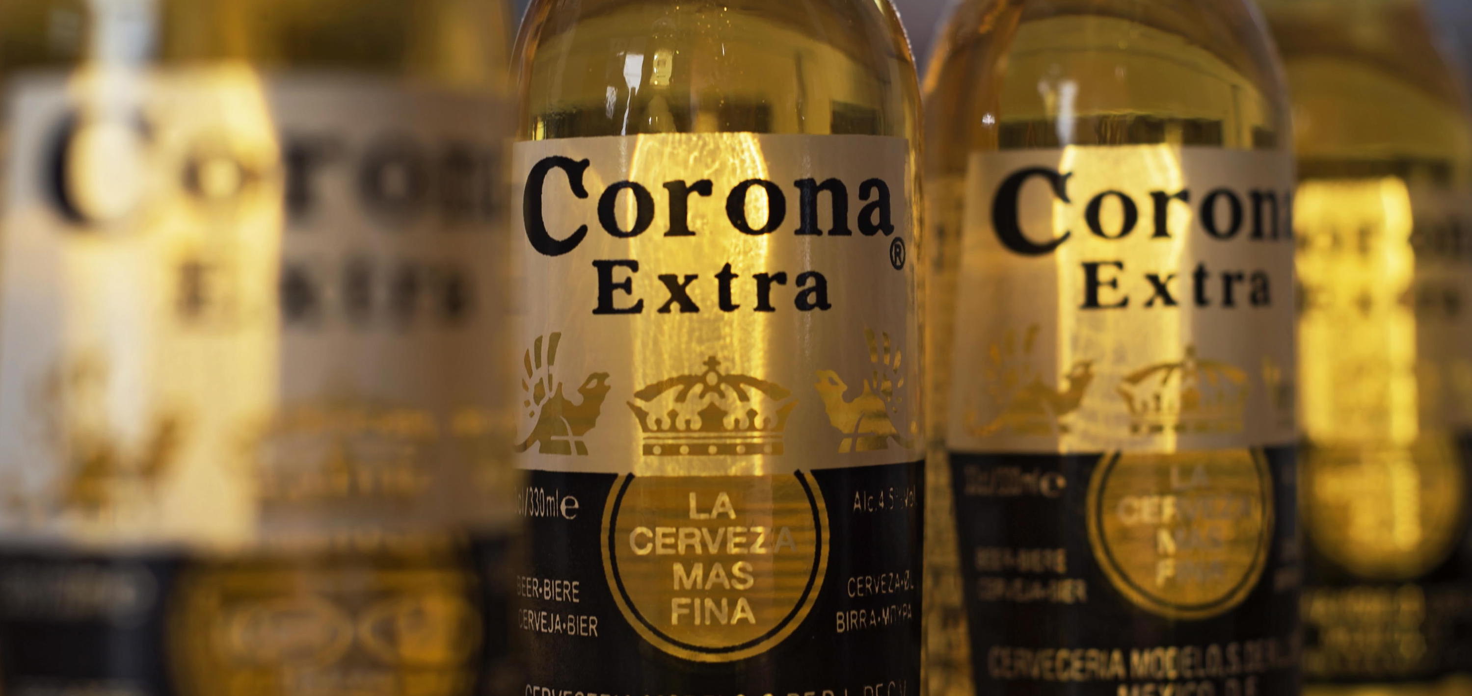 epa08252549 (FILE) – Bottles of Corona beer pictured in London, Britain, 28 September 2016 (reissued 27 February 2020). Reports on 27 February 2020 state the sales of Corona beer have fallen drastically. The losses in sales is widely attributed to the fact the beer’s name coming up in online searches for corona and virus, despite the fact that the beer and virus have nothing in common. Corona manufacturer Constellation Brands Inc. saw its shares fall eight per cent this week at the New York Stock Exchange. Corona is one of the most popular beer brands in the world.  EPA/HANNAH MCKAY *** Local Caption *** 53040098