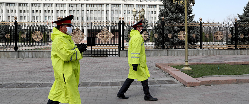 epa08324296 Police officers on a street in the center of Bishkek as an additional measure to prevent the spread of coronavirus disease (COVID-19) in Bishkek, Kyrgyzstan,  26 March 2020. Kyrgyzstan declared a state of emergency in the country since forty-four cases of the pandemic disease COVID-19 caused by the SARS-CoV-2 coronavirus have been confirmed.  EPA/IGOR KOVALENKO