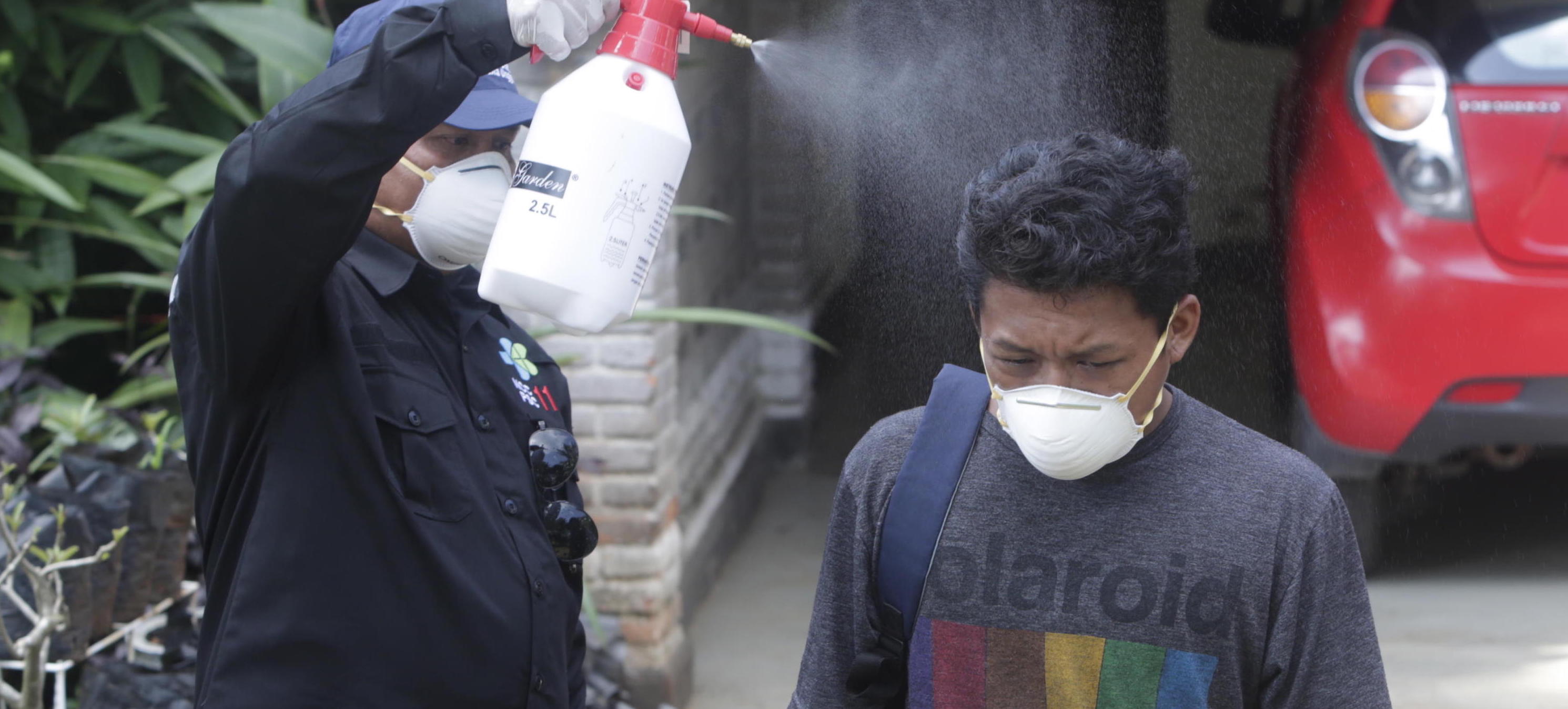 epa08263995 A health worker sprays a domestic helper with disinfectants in front of the residence of two people who tested positive for coronavirus, in Depok, Indonesia, 02 March 2020. Indonesia has confirmed two novel coronavirus cases in its territory after diagnosing two women living in Depok, a West Java suburb just outside Jakarta, who came in contact with a Japanese man coming from Malaysia who was already infected with the virus several days ago.  EPA/ADI WEDA