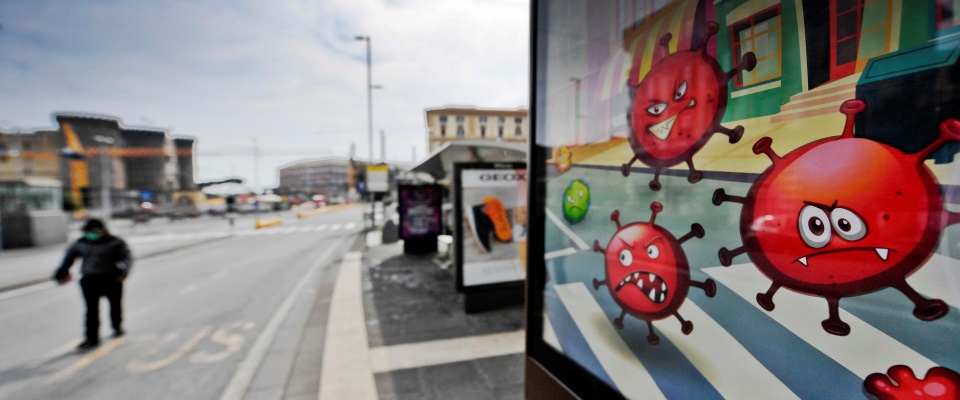 A banner in Naples, Italy, advertises a sanitizing company. In the graphics are visible, in a stylized form, the Covid 19 viruses as they appear under the microscope, 17 march 2020
ANSA / CIRO FUSCO