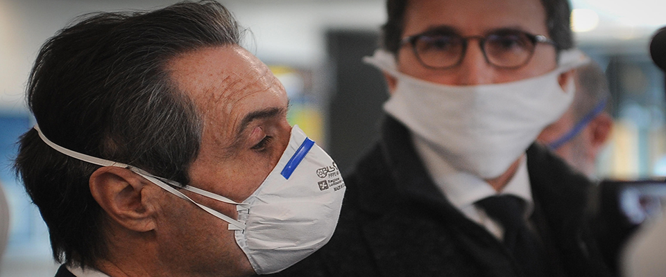 Lombardy governor Attilio Fontana (L) and Italian Regional Affairs Minister Francesco Boccia (R) welcome thirty doctors and nurses arriving from Albania to help hospitals in the Brescia area, during the country’s lockdown following the COVID-19 new coronavirus pandemic, at Villafranca airport in Verona, northern Italy, 29 March 2020. Italy is under lockdown in an attempt to stop the widespread of the SARS-CoV-2 coronavirus causing the Covid-19 disease. 
ANSA/CLAUDIO MARTINELLI