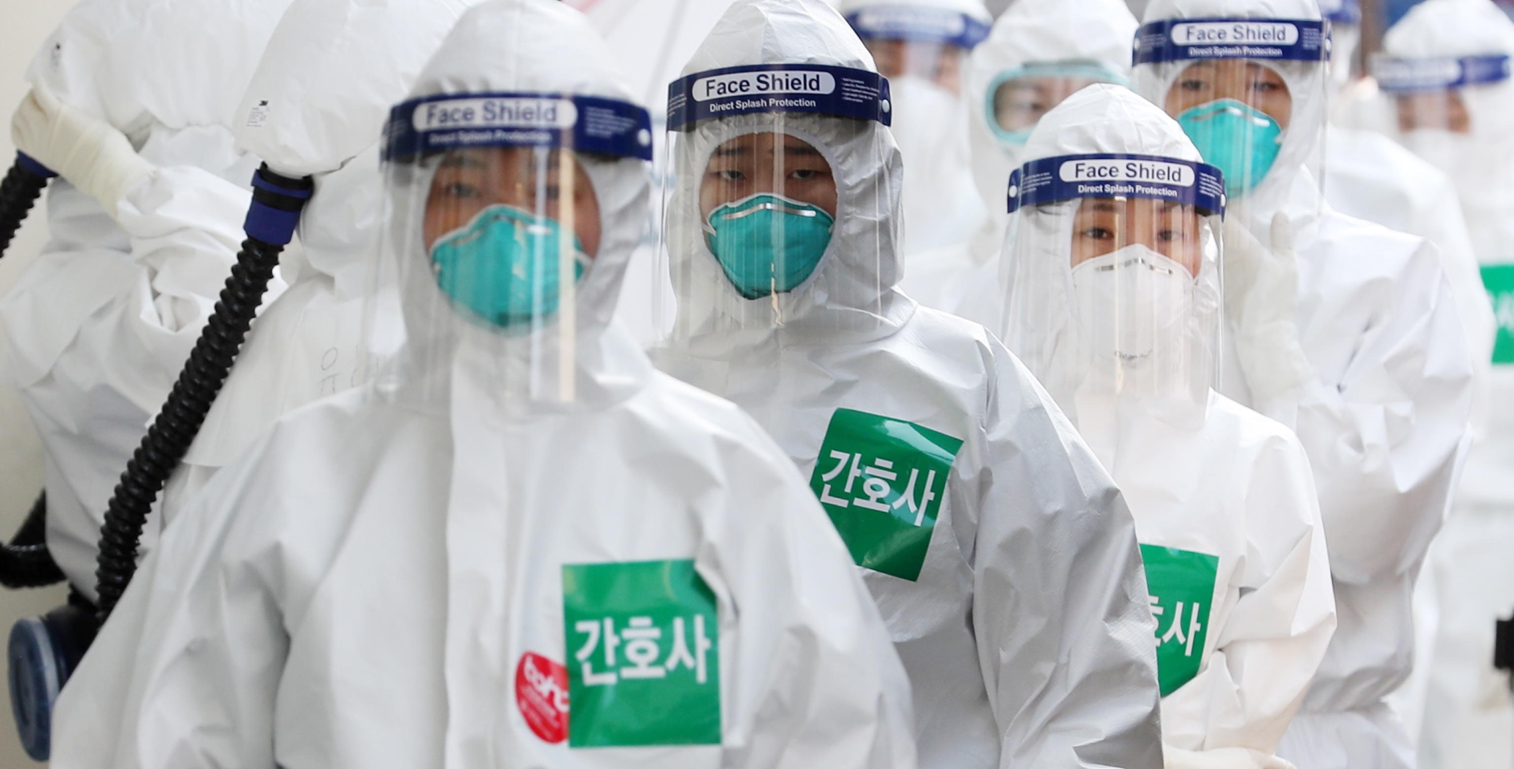 epa08347531 Nurses in full protective suits line up to enter the treatment ward for novel coronavirus patients at the Dongsan Hospital in Daegu, some 300 kilometers southeast of Seoul, South Korea, 07 April 2020.  EPA/YONHAP SOUTH KOREA OUT