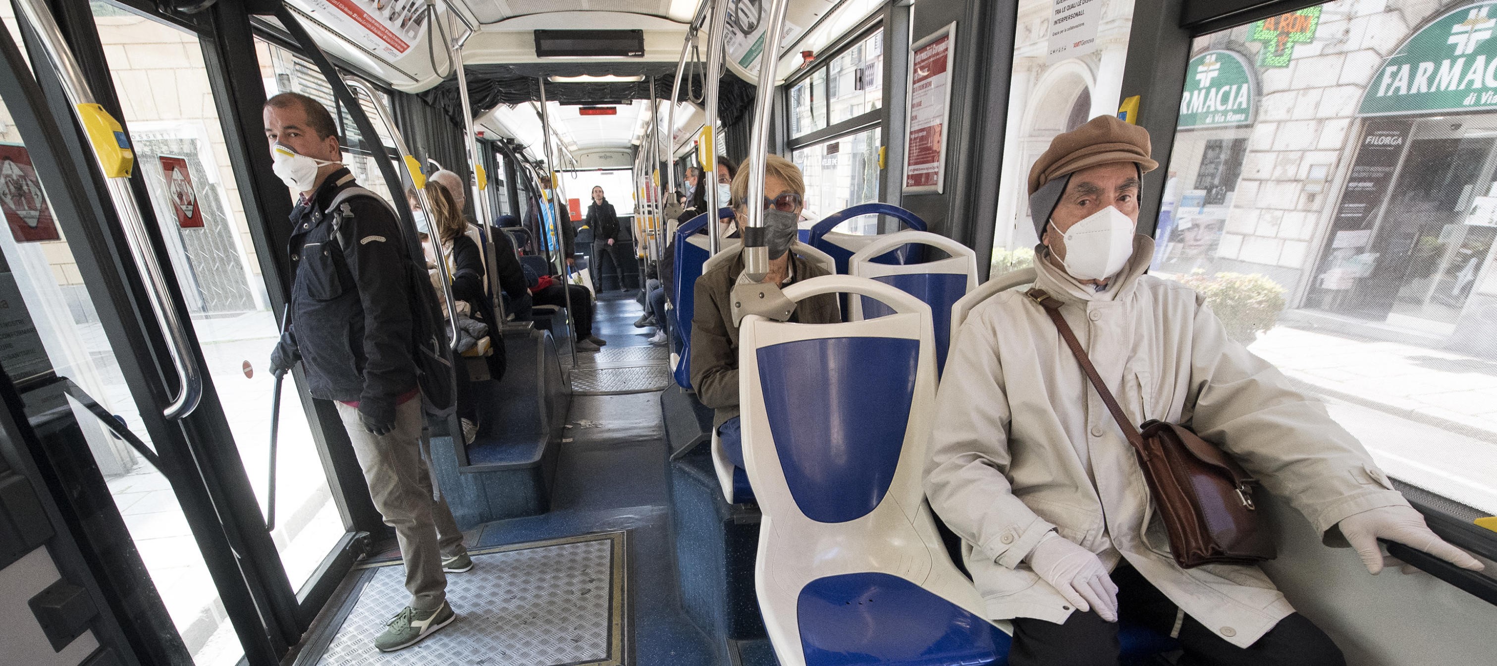 Passengers wearing protective mask on the bus in the middle of the city. Genova, Italy, 23 April 2020. Countries around the world are taking measures to stem the widespread of the SARS-CoV-2 coronavirus which causes the Covid-19 disease. ANSA/LUCA ZENNARO