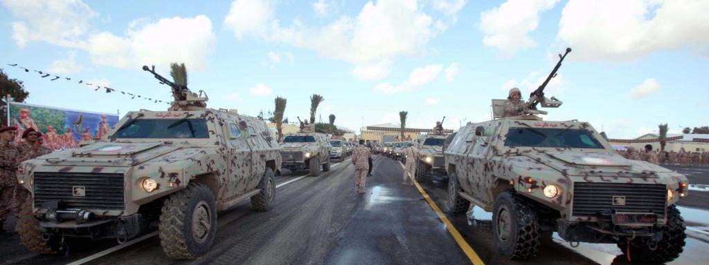 epa04024611 Libyan soldiers on their vehicles takes part in a military parade during a graduation ceremony for a new batch of Libyan National Army, in Tripoli, Libya, 16 January 2014.  EPA/SABRI ELMHEDWI