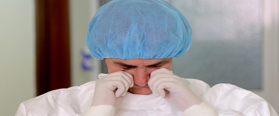 Albanian doctor Najada Como cries as she gives an interview at the Infective Disease Hospital turned to receive patients contaminated with the COVID-19 disease caused by the novel coronavirus in Tirana on May 1, 2020. – One of Europe’s poorest countries, Albania was quick to impose a draconian lockdown and has so far avoided the devastation seen in places like Italy, which lies just across the Adriatic sea. Some 30 people have died while less than 1,000 are known to be infected. But as the country now slowly eases its sweeping restrictions, exhausted doctors fear of a fresh inundation of infections in their hospital wards. (Photo by Gent SHKULLAKU / AFP)