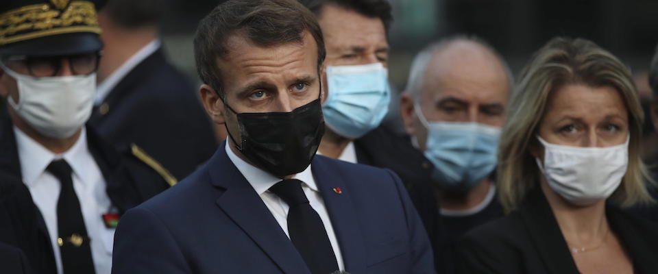 epa08727131 French President Emmanuel Macron, center, delivers his speech next to Environment minister Barbara Pompili  in Breil-sur-Roya, southeastern France, 07 October 2020. With more than a dozen dead and others missing, France and Italy are still assessing damage and cleaning up after violent rains that began Friday, sweeping away homes and unearthing bodies from cemeteries. French President Emmanuel Macron is visiting the mountainous area near the Mediterranean coast on 07 October, and promised government aid to flood victims.  EPA/Daniel Cole / POOL MAXPPP OUT