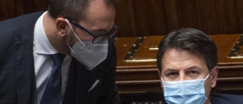 Italian Premier, Giuseppe Conte (R), listens the Minister of Justice, Alfonso Bonafede, during the debate that followed his speech in the Chamber of Deputies on the situation of the pandemic from Covid-19, Rome, Italy, 02 November 2020. According to reports, Conte said the Covid-19 pandemic situation in Italy is deteriorating adding that the contagion curve will force the government to prepare new restrictive measures.   ANSA / MAURIZIO BRAMBATTI