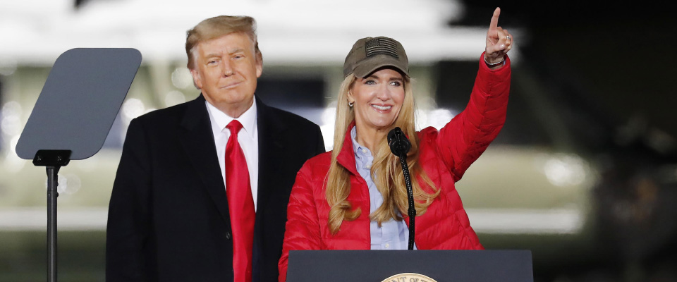 epa08919539 US President Donald J. Trump (L) ans Republican US Senator from Georgia Kelly Loeffler (R) speaks during an election eve campaign rally on behalf of Republican Georgia Senators Kelly Loeffler and David Perdue at Dalton Regional Airport in Dalton, Georgia, USA, 04 January 2021. Senator David Perdue is running Democrat Jon Ossoff and Republican Senator Kelly Loeffler is running against Reverend Raphael Warnock in the 05 January 2021 runoff election.  EPA/ERIK S. LESSER