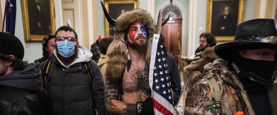 epa08923449 Supporters of US President Donald J. Trump gather outside of the Senate chamber after they breached the US Capitol security in Washington, DC, USA, 06 January 2021. Protesters stormed the US Capitol where the Electoral College vote certification for President-elect Joe Biden took place.  EPA/JIM LO SCALZO